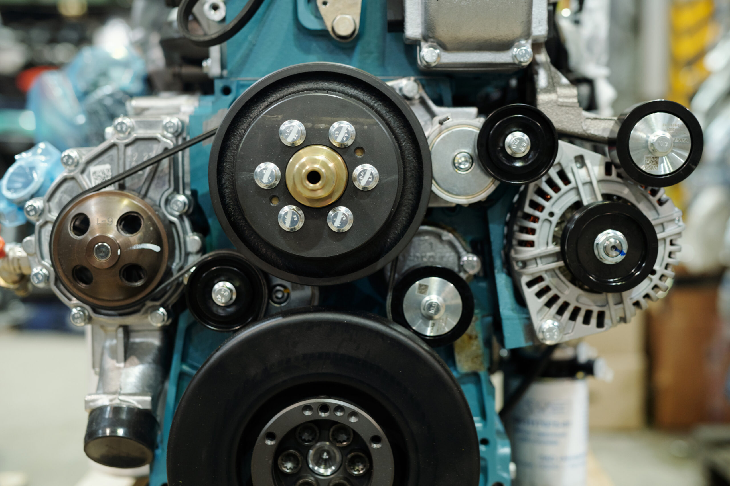 Close-up of working engine of huge industrial machine with rotating shafts